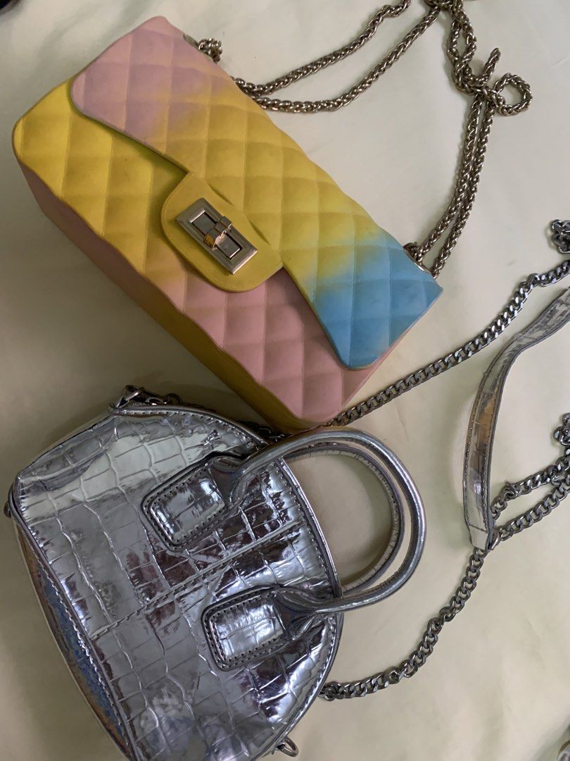 Take Two Silver Croc Handbag & Pastel Chain Bag (Category: Luxury Bags & Wallets) located in Manila. Submitted by leigh_dior (Listing ID 1437662597, Image 1). Description: Two stylish handbags are available. One is a silver, crocodile-textured handbag with a top handle and chain strap. The other is a pastel-colored chain bag with a quilted design. Both bags have chain straps. The pastel bag features a color gradient from pink to yellow to blue..