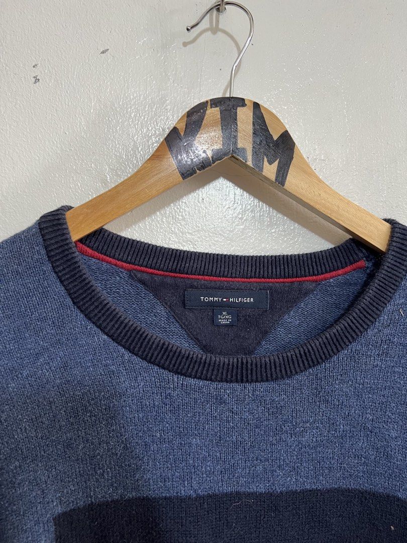 Tommy Hilfiger Sweater Knitted XL (Category: Coats, Jackets and Outerwear) located in Roxas, Mindoro Oriental. Submitted by oldschool_thriftph (Listing ID 1437589869, Image 3). Description: - Tommy Hilfiger sweater - Blue color - Iconic logo on front - XL size - Dimes 25x31 - Excellent condition - No issue - Crew neck - Ribbed cuffs with red accents - Made in China - Classic design - Perfect for casual wear.