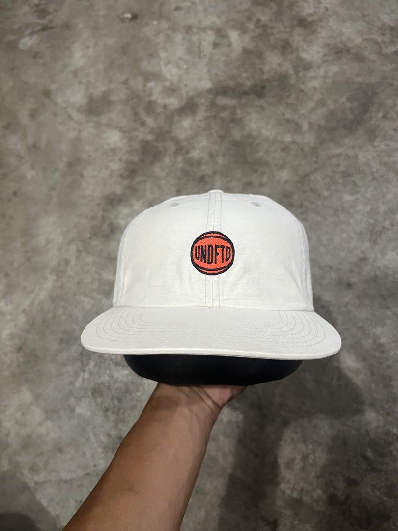 Undefeated "UNDFTD" Basketball Logo Six Panel Cap (Category: Caps & Hats) located in Naga. Submitted by nowhere_archive_shop (Listing ID 1437721134, Image 1). Description: Undefeated “UNDFTD” Basketball Logo Six Panel Cap Good Condition Sign Of Usage DM .