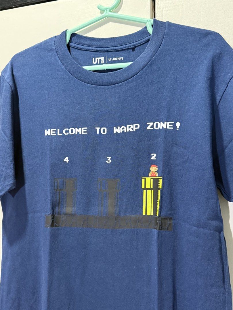 Uniqlo UT Archive Mario (blue) (Category: Shirts) located in Pasig City. Submitted by clau.ph (Listing ID 1437660656, Image 2). Description: Mens size XS.