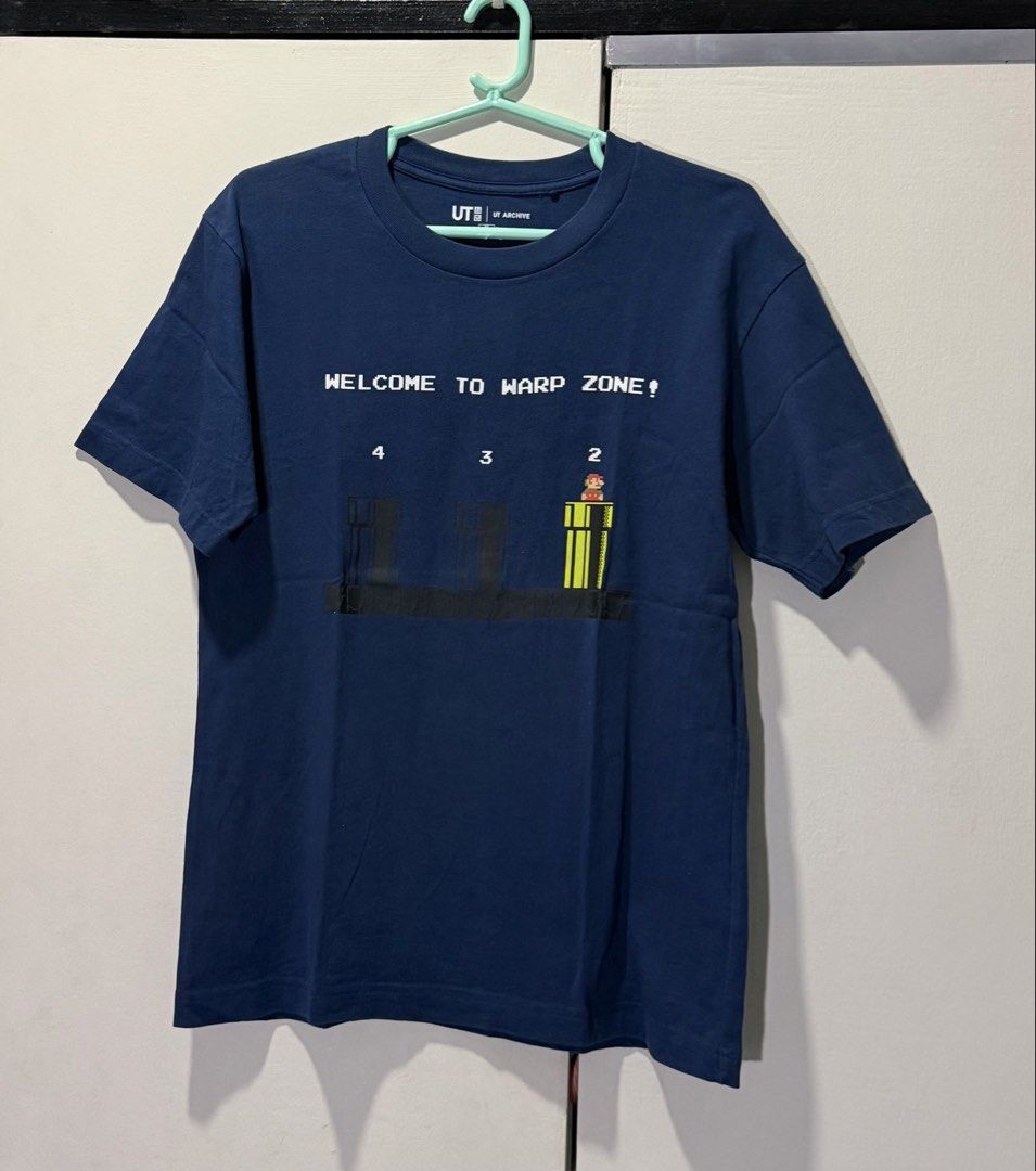 Uniqlo UT Archive Mario (blue) (Category: Shirts) located in Pasig City. Submitted by clau.ph (Listing ID 1437660656, Image 1). Description: Mens size XS.