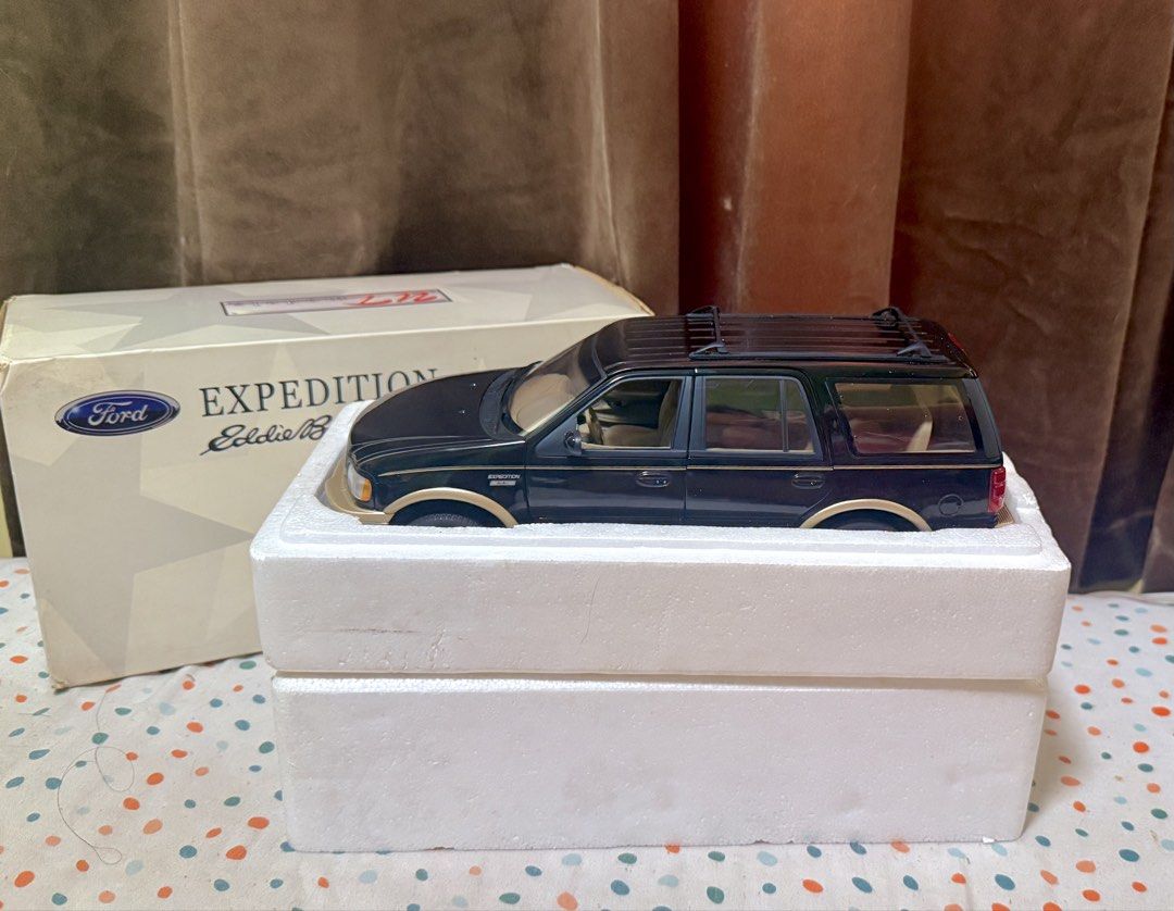 UT BLACK Ford Expedition Eddie Bauer 1:18 Scale (Category: Vehicle & Diecast Models) located in Manila. Submitted by yourtoothfairy (Listing ID 1437647064, Image 2). Description: - Ford Expedition Eddie Bauer diecast model - Scale: 1:18 - Color: Black exterior, tan interior - Includes original box and styrofoam packaging, never displayed. Wheels still screwed to the styro bottom . - Box condition: Shows some wear and tear Last photo is for refere