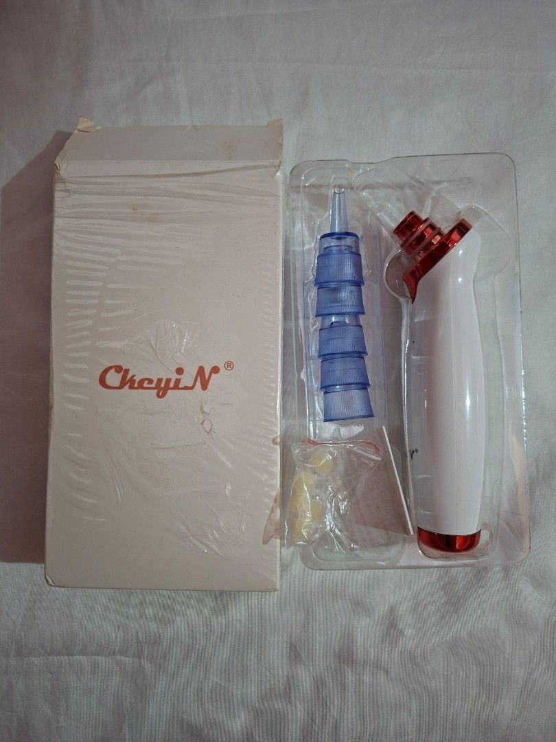 Vacuum Blackhead Remover (Category: Face Care) located in Cavite. Submitted by graciously_good (Listing ID 1437732610, Image 1). Description: - Vacuum Blackhead Extractor with five nozzles and extra rubbers and foam - Has three levels of sucking pressure - No idea if it works since I never tried and bought this years ago - Needs Type C Charger - Bought this one impulsively - Never used, only opened the packaging RFS: Declutter.