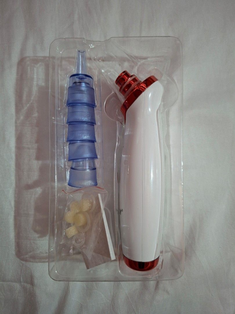 Vacuum Blackhead Remover (Category: Face Care) located in Cavite. Submitted by graciously_good (Listing ID 1437732610, Image 2). Description: - Vacuum Blackhead Extractor with five nozzles and extra rubbers and foam - Has three levels of sucking pressure - No idea if it works since I never tried and bought this years ago - Needs Type C Charger - Bought this one impulsively - Never used, only opened the packaging RFS: Declutter.