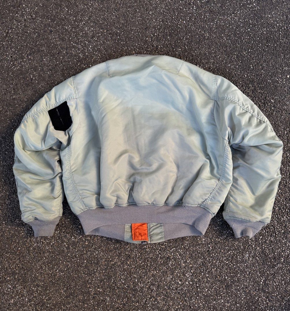 Vintage Alpha Industries MA-1 Bomber Jacket (Category: Coats, Jackets and Outerwear) located in Quezon City. Submitted by though.bare (Listing ID 1437747650, Image 2). Description: Fits on L up to XL for Men In worn condition, has a patched up tear on the shoulder (doesn't penetrate the reverse side) Width : 26" Length : 25" Sleeve : 24" Shoulder : 19" No-when worns. Listings not marked sold/reserved are available. These are preloved/used items, 