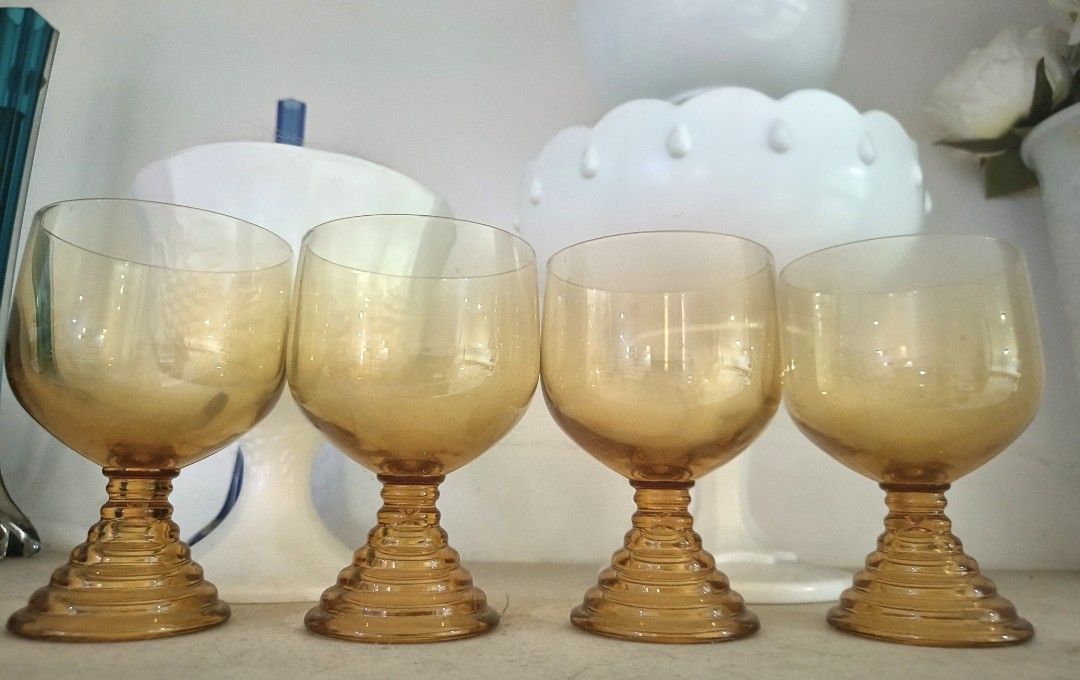 Vintage Amber Wine Glasses (Category: Dinnerware & Cutlery) located in Cainta. Submitted by mitchiemochi (Listing ID 1437685087, Image 2). Description: - Set of 4 vintage amber wine glasses - Unique spiral stem - Perfect for wine or other drinks - Adds elegance to your table - Stylish and collectible.