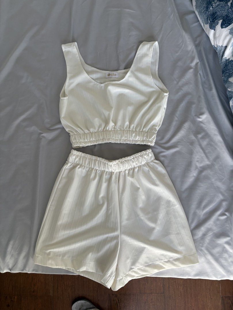 White swimwear cover (Category: Sets or Coordinates) located in Angeles City. Submitted by classictop (Listing ID 1437734792, Image 2). Description: - Cream-colored co-ord set - Sleeveless crop top with elastic waistband - Matching high waisted shorts - Subtle vertical striped pattern - Lightweight material - Perfect for summer - Comfortable and suitable for warm weather.
