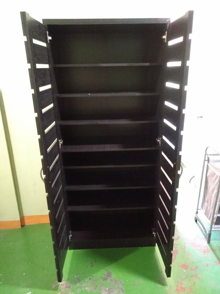 Wooden Shoe Cabinet with Multiple Shelves (Category: Shelves, Cabinets & Racks) located in Manila. Submitted by jerrymieborda05 (Listing ID 1437745781, Image 1). Description: - Stylish shoe cabinet - Multiple shelves for organized storage - Dark finish - Slatted door design - Made of wood - Two doors - Practical shoe storage solution - Space-saving design.