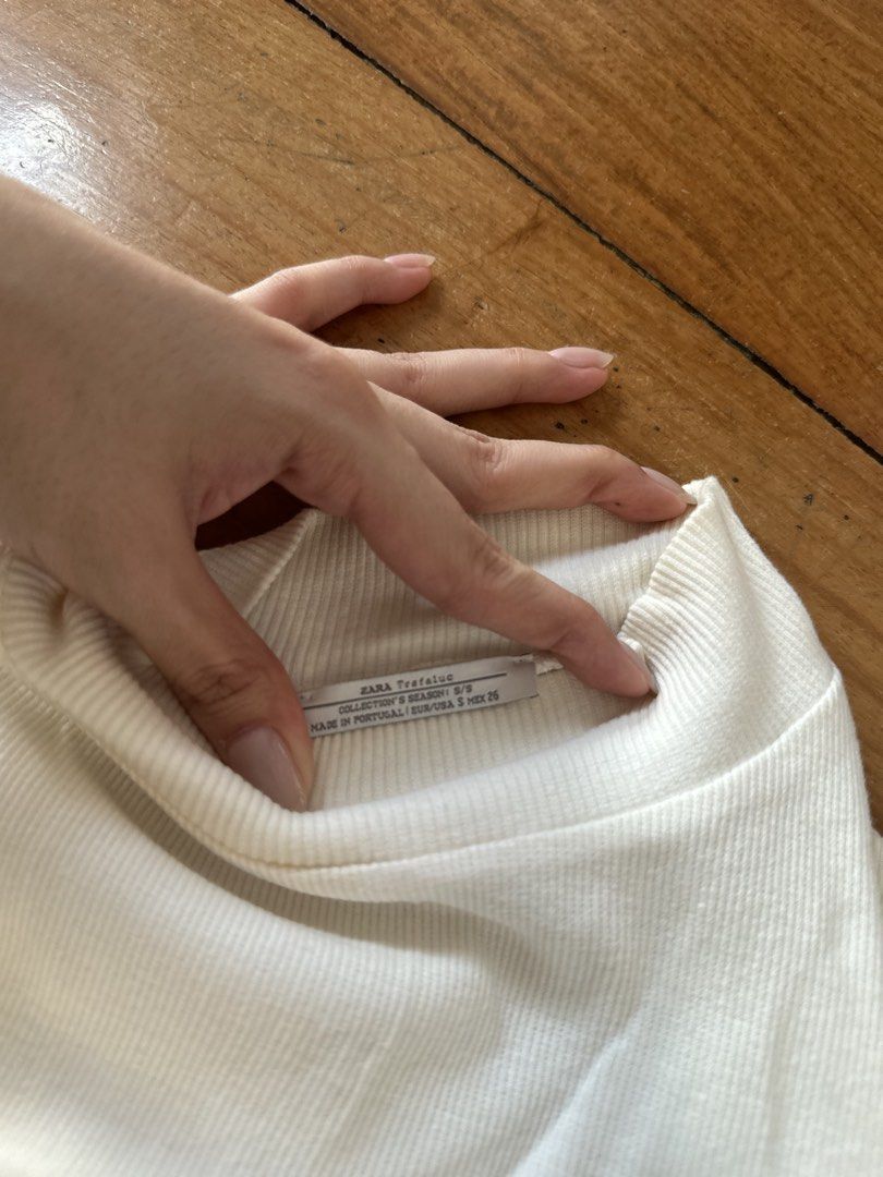 Zara Trafaluc Ribbed Top (Category: Blouses) located in Quezon City. Submitted by cam.declutters (Listing ID 1437667967, Image 2). Description: - Zara Trafaluc cream ribbed top - Size: S - Features: Mock neck, long sleeves - Made in Portugal - Versatile for layering or wearing alone - Comfortable, lightweight fabric.