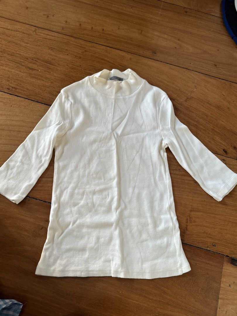 Zara Trafaluc Ribbed Top (Category: Blouses) located in Quezon City. Submitted by cam.declutters (Listing ID 1437667967, Image 1). Description: - Zara Trafaluc cream ribbed top - Size: S - Features: Mock neck, long sleeves - Made in Portugal - Versatile for layering or wearing alone - Comfortable, lightweight fabric.