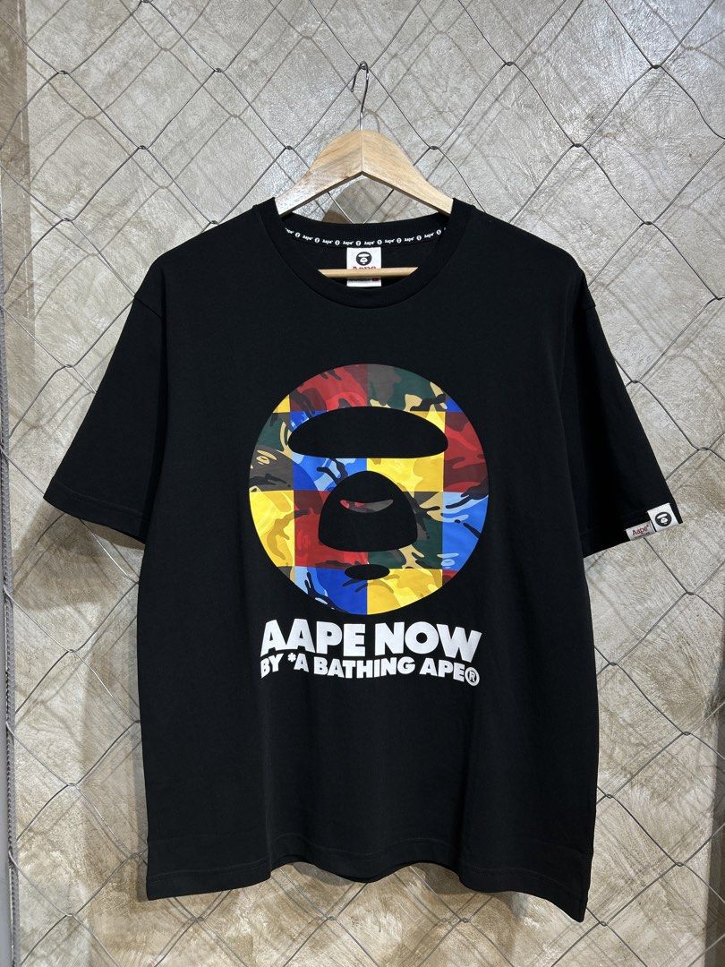 AAPE NOW by A Bathing Ape T-shirt (Category: Tshirts & Polo Shirts ) located in Manila. Submitted by ardobe.mnl (Listing ID 1437897106, Image 1). Description: -Aape Multicolor Face Logo Black Tee. Size: Large Dimes: 21.5x28 Condition: Good asnew Flaw: None! Dm for inquiries! 📥.