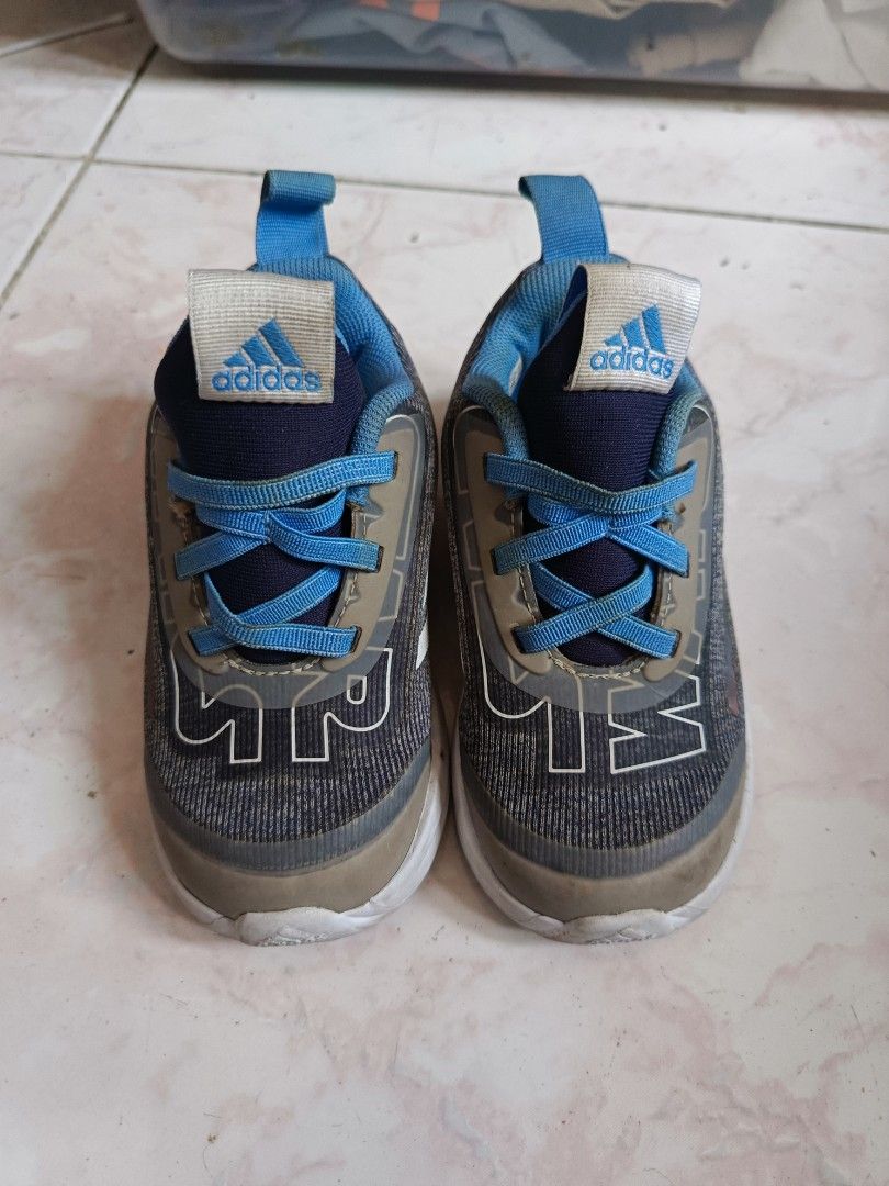 Adidas Star wars Toddler Shoes (Category: Babies & Kids Fashion) located in Paombong. Submitted by eveiveneg09 (Listing ID 1437794432, Image 1). Description: - Adidas toddler shoes - Color: Gray and blue - White soles - Blue laces and accents - Adidas logo on the tongue - Mesh-like material.