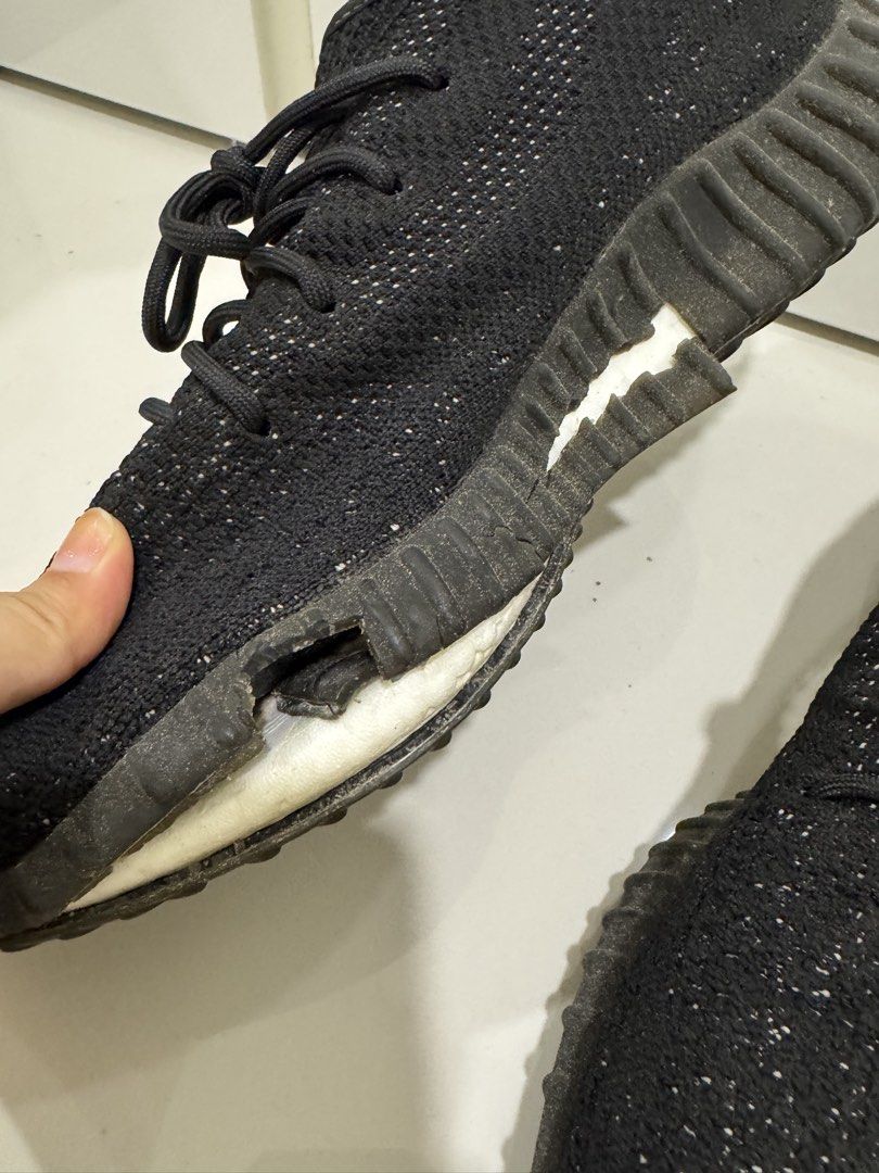 Adidas Yeezy Boost 350 V2 Black (Category: Sneakers) located in Singapore. Submitted by _misslemon (Listing ID 1437893726, Image 2). Description: - Significant wear and tear - Sole damage present - Priced to sell - Ideal for project or parts - Please view photos for condition details.
