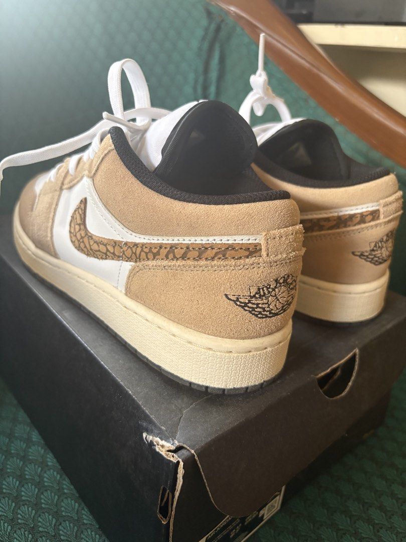 Air Jordan 1 Low SE (GS) (Category: Sneakers) located in Antipolo. Submitted by theeditedcloset (Listing ID 1437786330, Image 2). Description: - Air Jordan 1 Low SE (GS) sneakers - Size: 6Y (UK 5.5, EUR 37, CM 24) - Color: White and tan - Features a unique pattern on the swoosh and heel - Comes with the original box - has creases (as seen in photos) but otherwise, good as new.