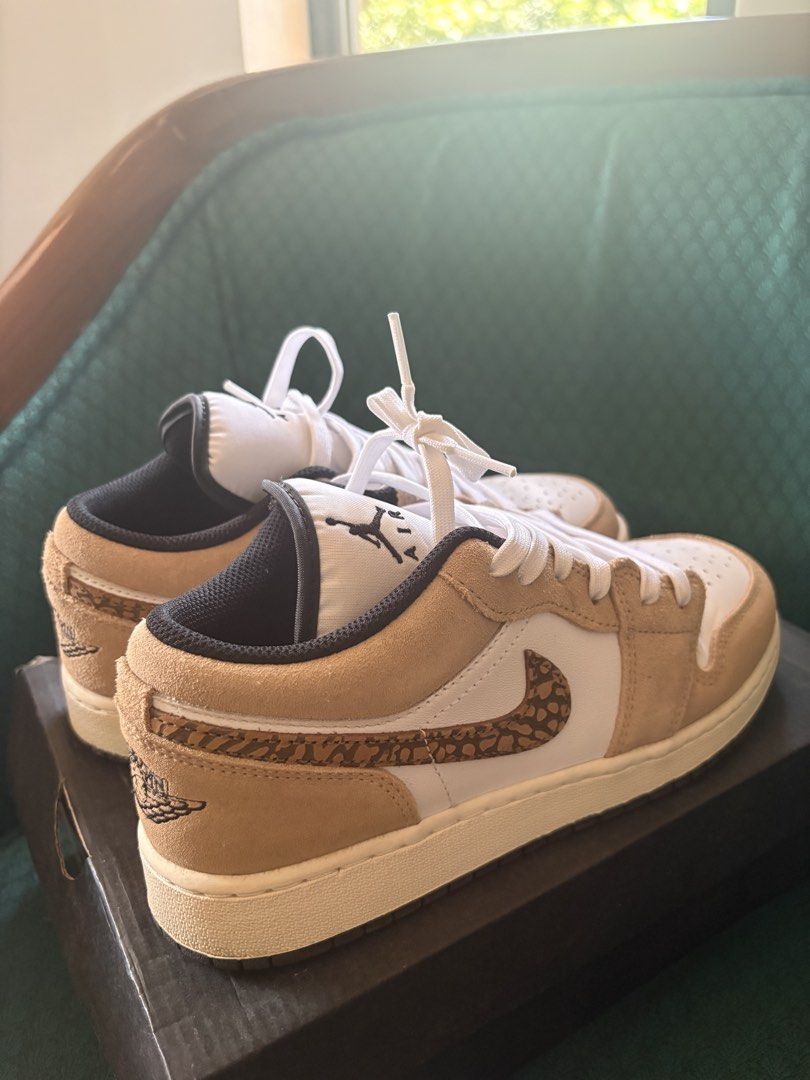 Air Jordan 1 Low SE (GS) (Category: Sneakers) located in Antipolo. Submitted by theeditedcloset (Listing ID 1437786330, Image 3). Description: - Air Jordan 1 Low SE (GS) sneakers - Size: 6Y (UK 5.5, EUR 37, CM 24) - Color: White and tan - Features a unique pattern on the swoosh and heel - Comes with the original box - has creases (as seen in photos) but otherwise, good as new.