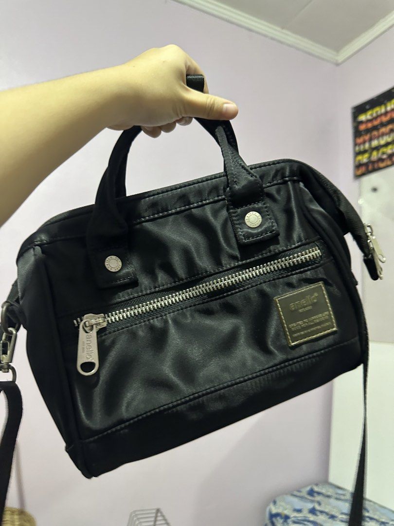 Anello 2-Way Shoulder Bag (Category: Shoulder Bags) located in Antipolo. Submitted by ttrends (Listing ID 1437875987, Image 3). Description: - Black Anello 2-way shoulder bag - Top handle and detachable shoulder strap - Front zipper pocket - Main compartment with interior pockets - Silver zipper and hardware - Anello logo visible.