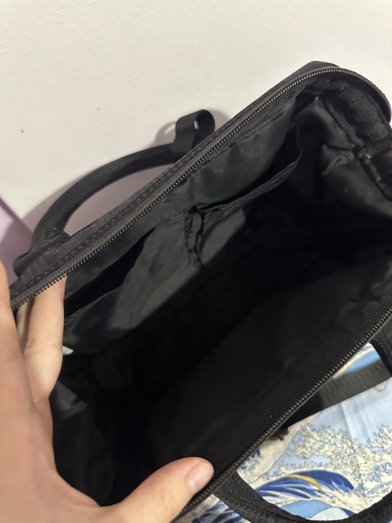 Anello 2-Way Shoulder Bag (Category: Shoulder Bags) located in Antipolo. Submitted by ttrends (Listing ID 1437875987, Image 2). Description: - Black Anello 2-way shoulder bag - Top handle and detachable shoulder strap - Front zipper pocket - Main compartment with interior pockets - Silver zipper and hardware - Anello logo visible.