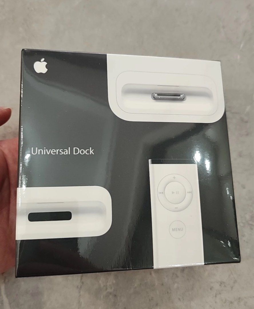Apple Universal iPod Dock (Category: Portable Audio Accessories) located in Manila. Submitted by yezdeal2017 (Listing ID 1437913212, Image 1). Description: Brand New Universal Apple Universal Dock with remote. Compatible with various iPod and iPhone models, including iPod classic, iPod Video iPod touch, and iPhone 3G. Includes adapters for different devices. The box shows the dock and remote, along with a list of compatible devices. Shipping: LBC
