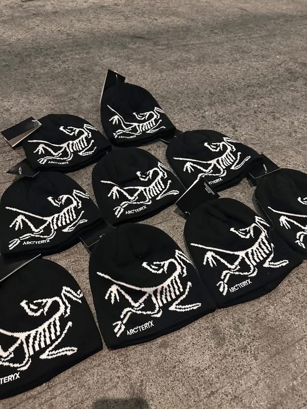 Arc'teryx Beanie (Category: Caps & Hats) located in Manila. Submitted by lancephili44479 (Listing ID 1437883286, Image 2). Description: - Black Arc'teryx beanie - White Arc'teryx logo on front - Folded cuff design - Made of knit material - Includes attached tag.
