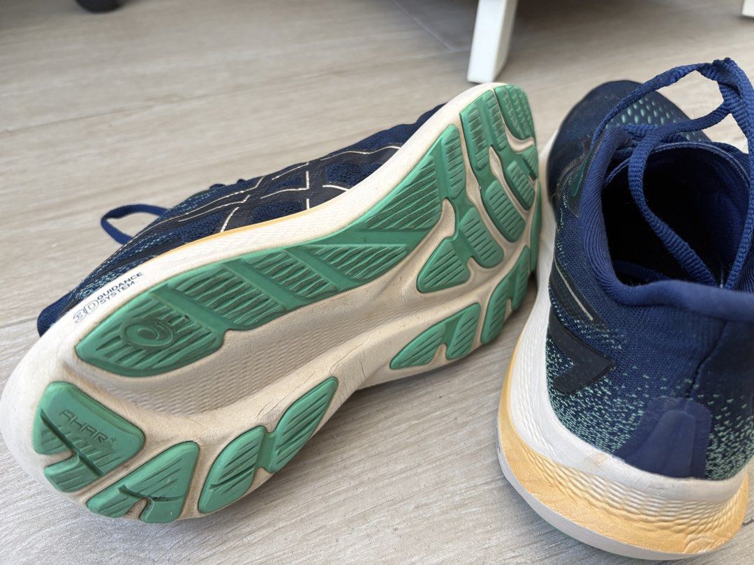 Asics GT-2000 12 Running Shoes - Navy (Category: Sneakers) located in Manila. Submitted by piajao (Listing ID 1437775659, Image 3). Description: - Asics GT-2000 12 running shoes - Color: Navy blue - Size: US 8 Womens - Midsole: White with yellow accent - Outsole: Green - Closure: Lace-up - Features the Asics logo Price slightly negotiable.