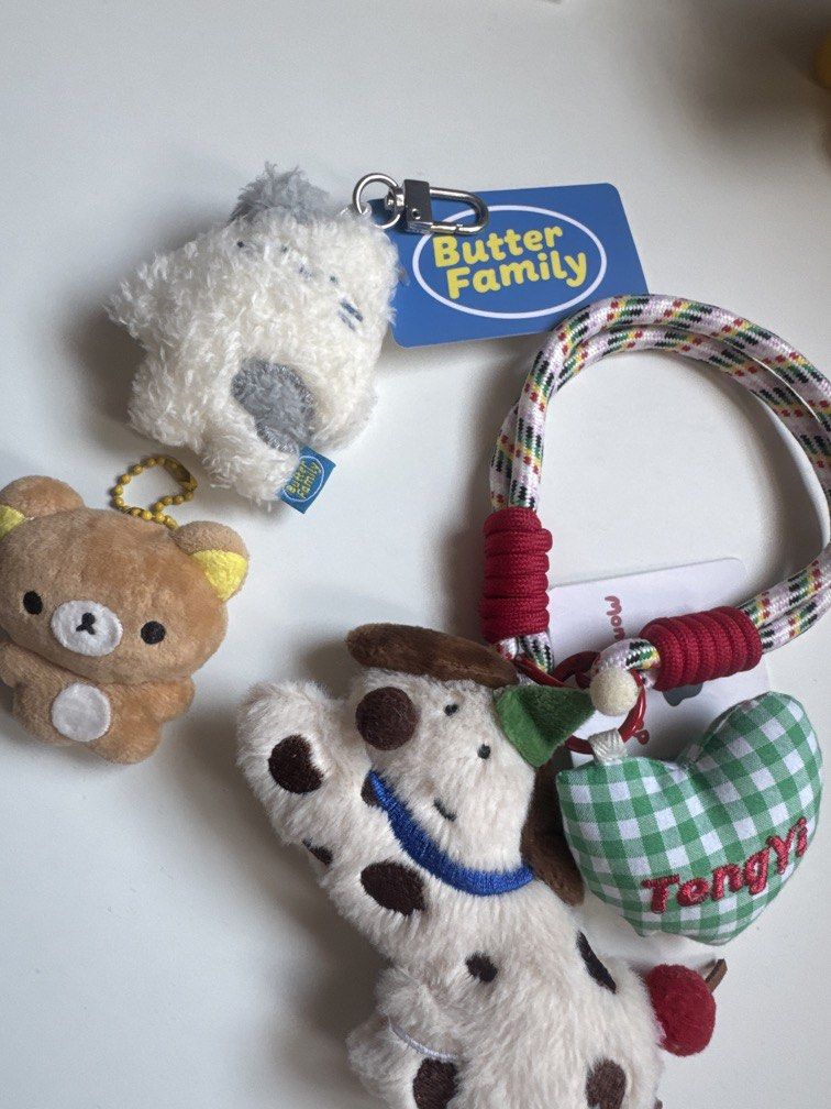 Assorted keychains (Category: Character Goods) located in Singapore. Submitted by ilovefruitcake (Listing ID 1437790165, Image 1). Description: Butter keychain $4 Dog keychain $5.50 Rilakkuma (handmade) $12.