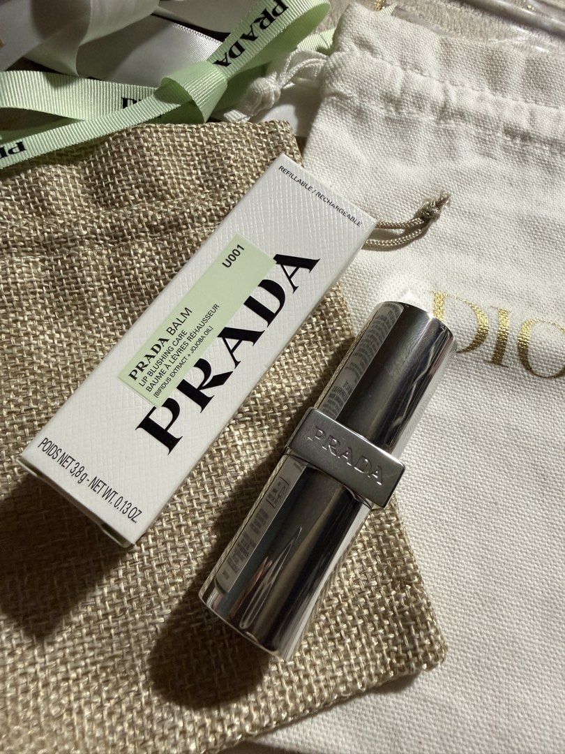 Authentic preloved Prada lipbalm (Category: Makeup) located in Rizal. Submitted by jayolts (Listing ID 1437930997, Image 2). Description: Preloved authentic Prada lipbalm Bought @greenbelt 5 Used 2-3 times lang din Color changing tech sya Ito yung nagpi-pink. I don’t want to use na since super bango ng balm and whenever I use it I feel like nakakain ko yung scent. Sanitized already. Free sf via Jnt.