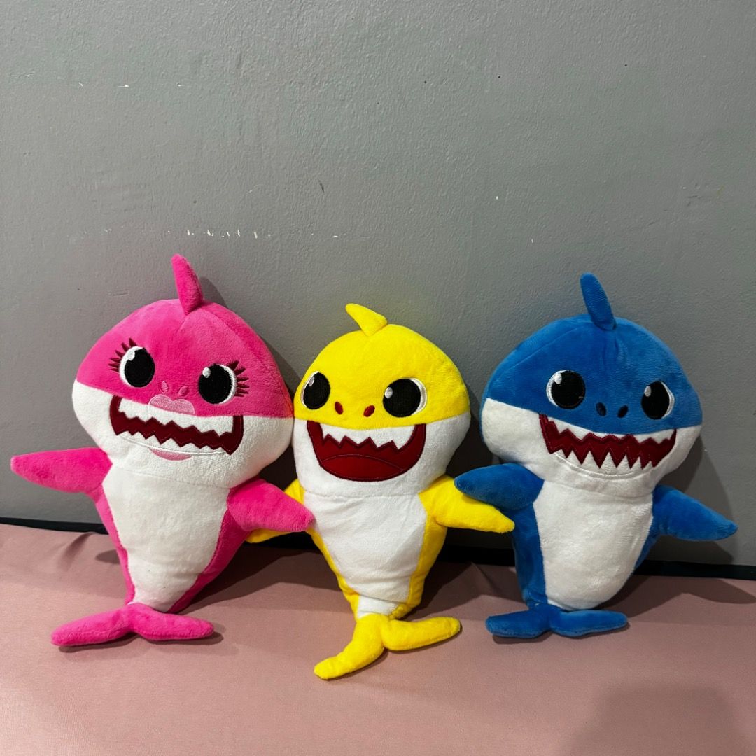 Baby Shark Plush Toys (Category: Plushies & Soft Toys) located in Manila. Submitted by louvemaria (Listing ID 1437857058, Image 1). Description: - 120 each - Set of 3 Baby Shark plush toys - Includes pink, yellow, and blue sharks - Each plush has a smiling face - Features arms and fins - Perfect for Baby Shark fans!.