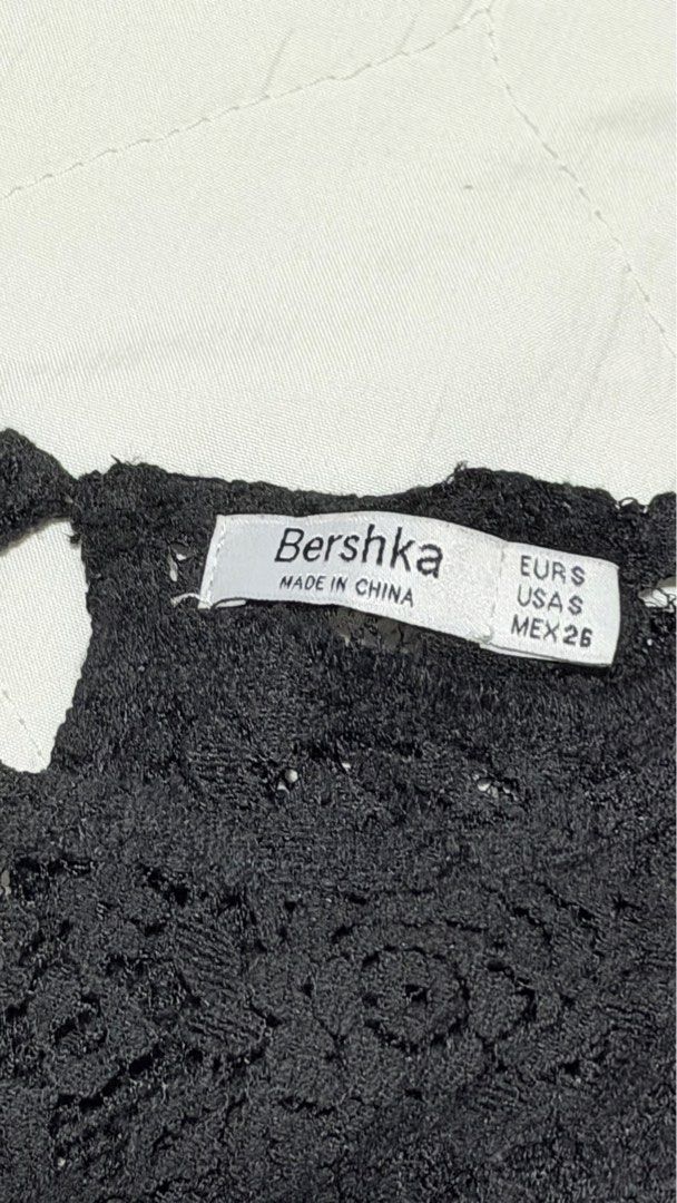 Bershka Black Lace Top (Category: Sleeveless) located in Manila. Submitted by hellokittyjhoe (Listing ID 1437817985, Image 2). Description: - Bershka black lace top - Size: EUR S, USA S, MEX 26 - Features: Long sleeves, ruffled front - Made in China - Dress up or down.