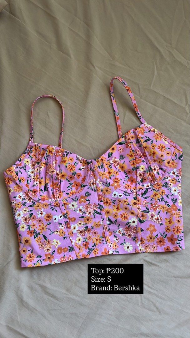 Bershka Floral Top - Size S (Category: Blouses) located in Cebu City. Submitted by rnzlvne (Listing ID 1437865026, Image 1). Description: - Bershka floral top - Size: S - Color: Pink base with floral pattern - Design: Thin straps, bustier style - Condition: Good - Perfect for casual wear or summer events.