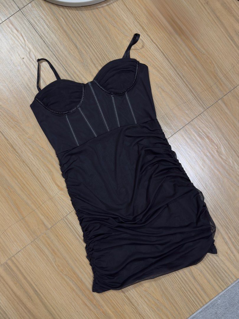 Black Corset Bodycon Mini Dress (Category: Dresses) located in Manila. Submitted by khitkhat (Listing ID 1437865433, Image 2). Description: - Black mini dress - Corset-style bodice with thin straps - Ruched skirt - Bodycon fit - Soft, stretchy material - Flattering silhouette - Perfect for a night out.