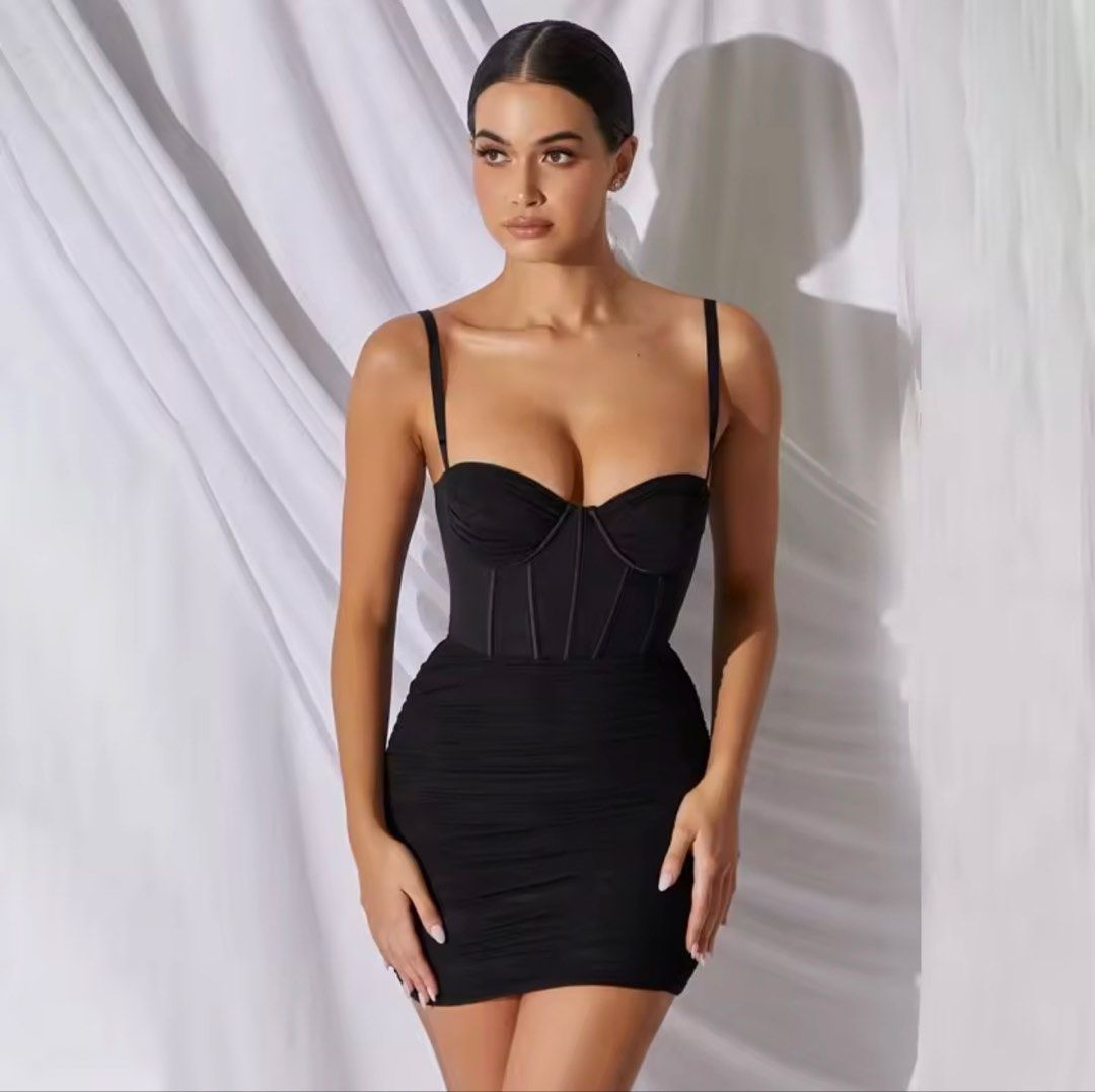 Black Corset Bodycon Mini Dress (Category: Dresses) located in Manila. Submitted by khitkhat (Listing ID 1437865433, Image 1). Description: - Black mini dress - Corset-style bodice with thin straps - Ruched skirt - Bodycon fit - Soft, stretchy material - Flattering silhouette - Perfect for a night out.