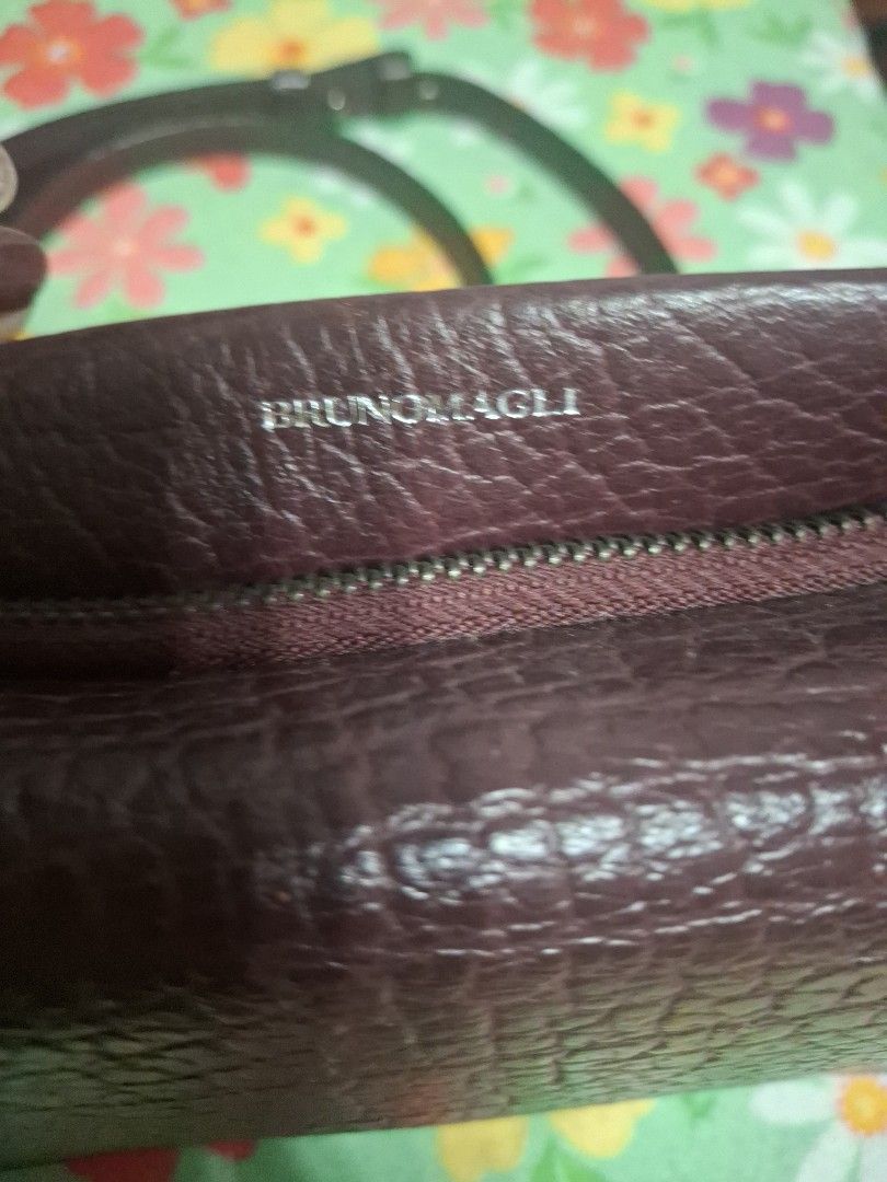 Bruno Magli Crossbody Bag (Category: Cross-body Bags) located in Quezon City. Submitted by lady.fox (Listing ID 1437847011, Image 2). Description: ***Please be reminded that the quality of the picture differs from the actual. Just message me once you need additional pictures or a video clip*** Crossbody bag features a textured exterior and a zippered main compartment. The interior lining has a patterned design. It includes a detachable strap for 