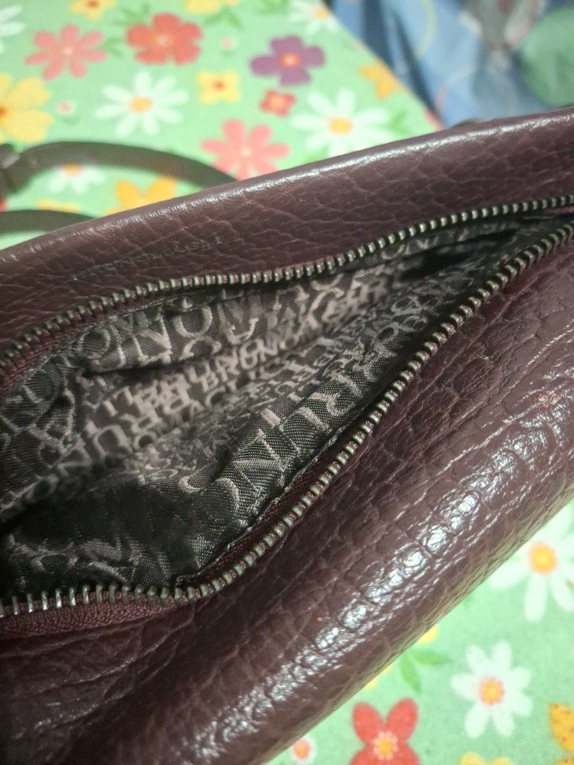 Bruno Magli Crossbody Bag (Category: Cross-body Bags) located in Quezon City. Submitted by lady.fox (Listing ID 1437847011, Image 3). Description: ***Please be reminded that the quality of the picture differs from the actual. Just message me once you need additional pictures or a video clip*** Crossbody bag features a textured exterior and a zippered main compartment. The interior lining has a patterned design. It includes a detachable strap for 