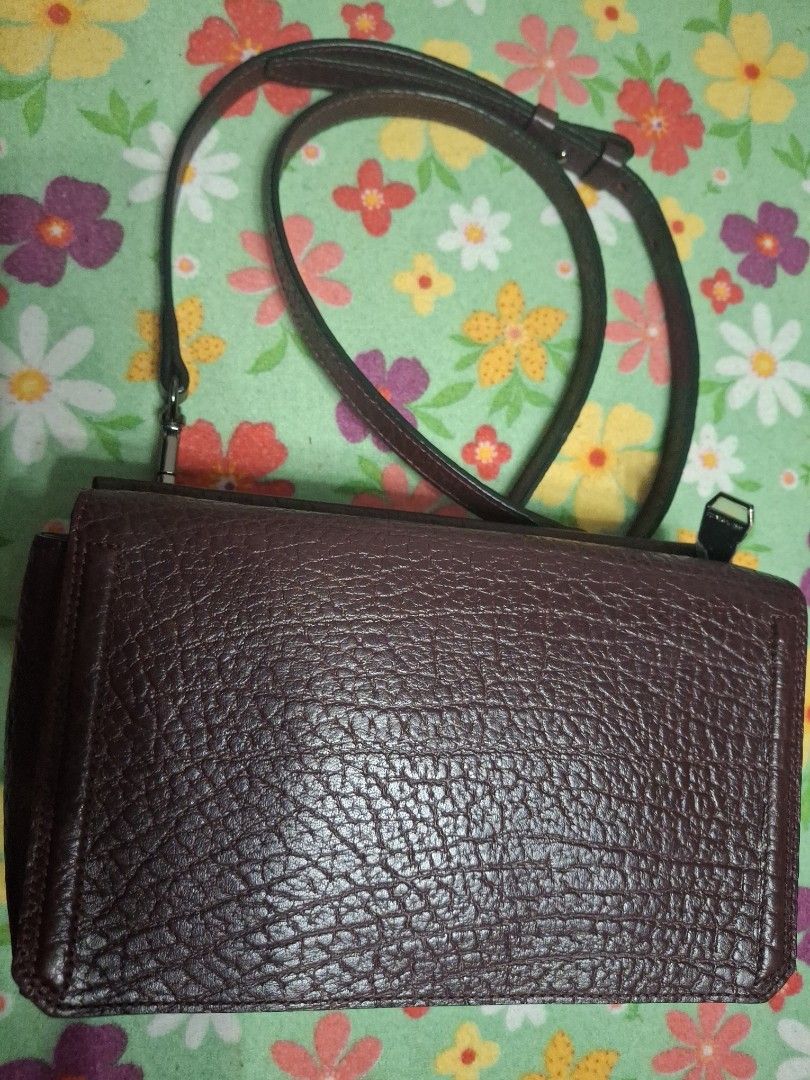 Bruno Magli Crossbody Bag (Category: Cross-body Bags) located in Quezon City. Submitted by lady.fox (Listing ID 1437847011, Image 1). Description: ***Please be reminded that the quality of the picture differs from the actual. Just message me once you need additional pictures or a video clip*** Crossbody bag features a textured exterior and a zippered main compartment. The interior lining has a patterned design. It includes a detachable strap for 