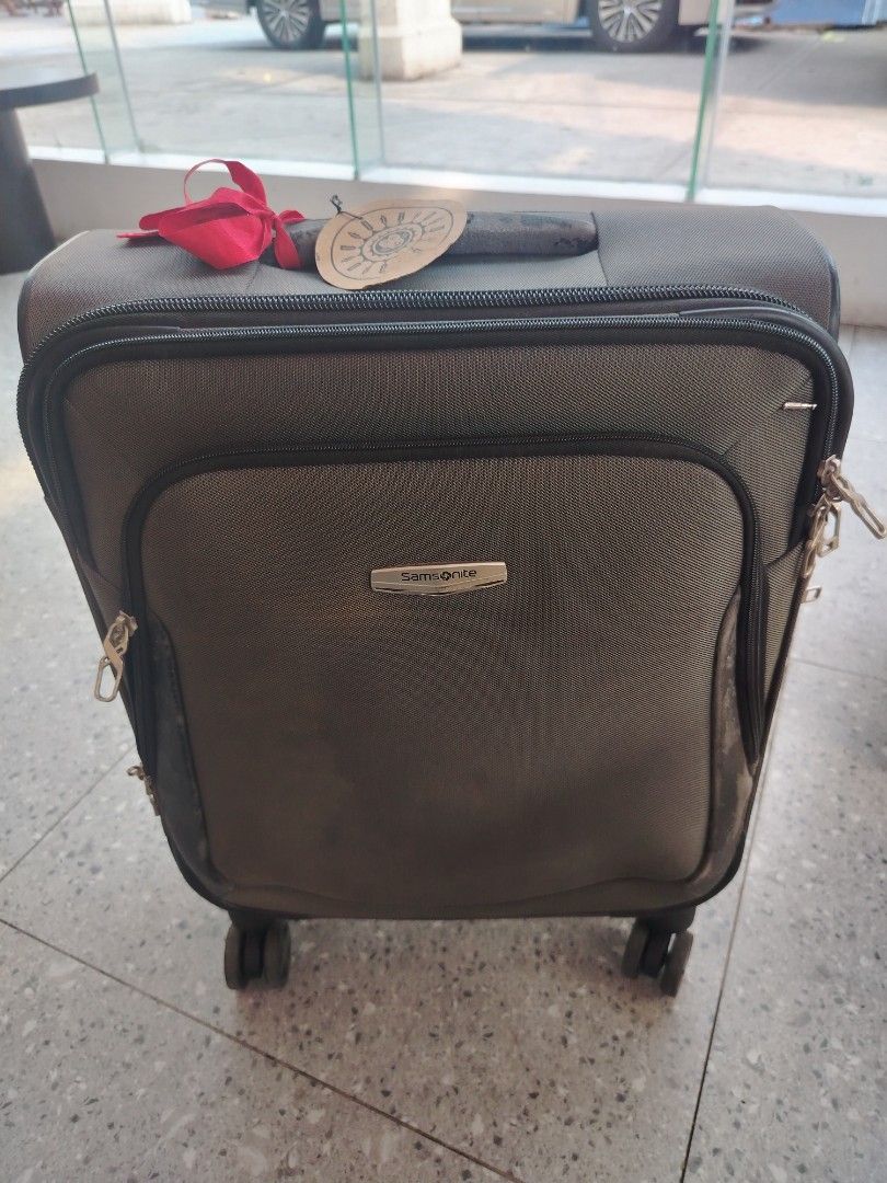 Cabin Samsonite Spinner Luggage (Category: Luggage) located in Manila. Submitted by purediamond888 (Listing ID 1437932839, Image 2). Description: - Samsonite spinner luggage - Dark grey exterior - Multiple compartments - Telescopic handle and wheels for easy transport - Interior mesh pocket - Interior straps to secure belongings - Original tags still attached - Unused condition.