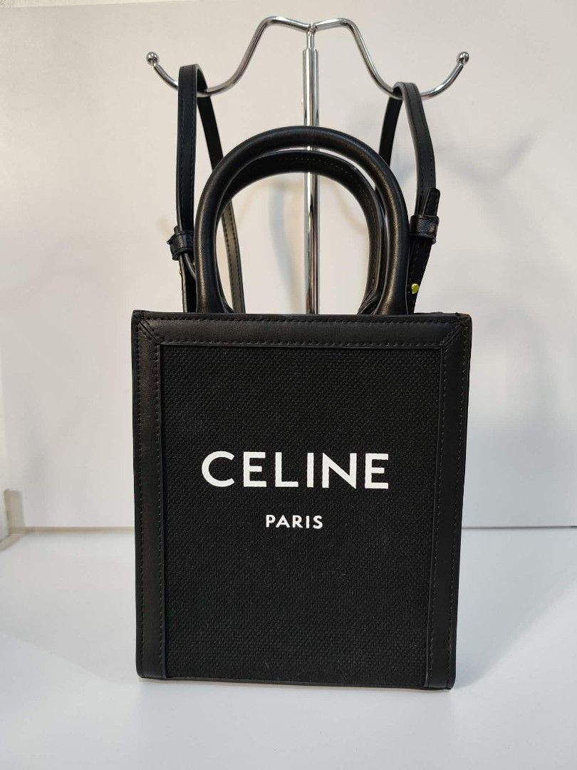 Celine Mini Vertical Cabas Tote Bag (Category: Luxury Bags & Wallets) located in Bulacan. Submitted by abejeroamy80846 (Listing ID 1437873762, Image 1). Description: - Celine Mini Vertical Cabas Tote Bag - Canvas body - Leather handles and trim - Detachable shoulder strap - Interior small pocket - Celine Paris logo on front.