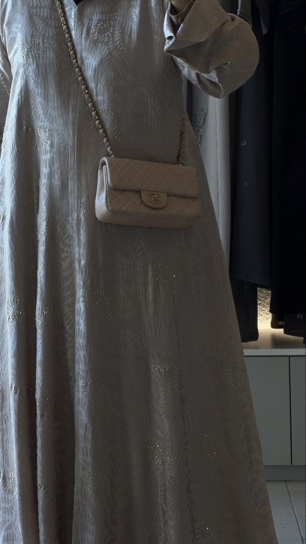 Chanel mini rectangular (Category: Bags & Wallets) located in Ampang. Submitted by banyakbetulbaju (Listing ID 1436998446, Image 1). Description: - Chanel mini rectangular - iridescent beige color - Iconic quilted design - Signature CC turn-lock closure - Gold chain strap - Includes dust bag and box - A timeless and elegant piece.