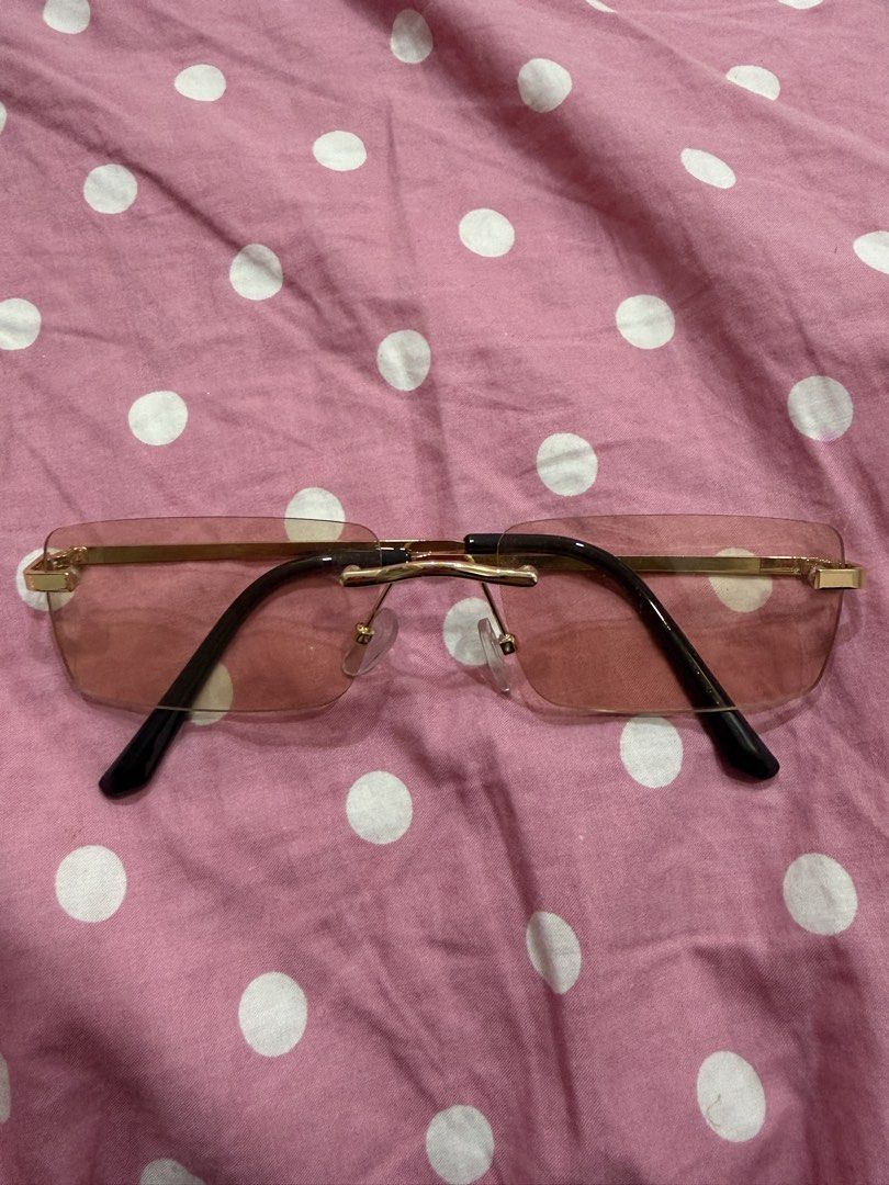 Chic Aesthetic Rimless Sunglasses with Brown Tint (Category: Sunglasses & Eyewear) located in Pasig City. Submitted by peonyfield (Listing ID 1437898026, Image 1). Description: - Gold rimless frame - Classic rectangular shape - Black arms - Sleek and modern design - Perfect for everyday wear.