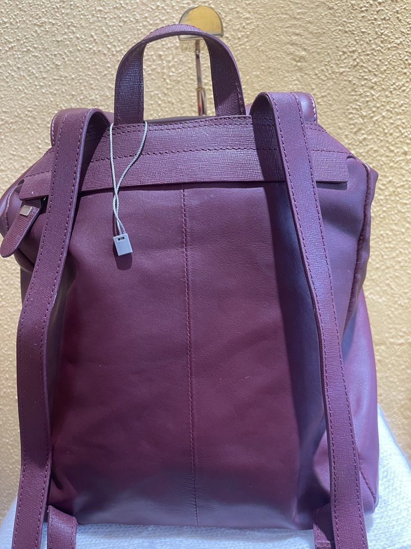 MILESTONE SALE: Chic merlot red wine backpack (Category: Backpacks) located in Dasmarinas. Submitted by hwcatbp (Listing ID 1437826490, Image 3). Description: ℹ️ Chic merlot red wine backpack ℹ️ Condition: Excellent to Very Good condition (Rank 9.5/10). ℹ️ Details: 13x6x4 inches. Flap closure with drawstring. Very spacious inside and has outer pocket. All have markings and has the string tag intact. ℹ️ Inclusions: Generic dust bag, and silica gel