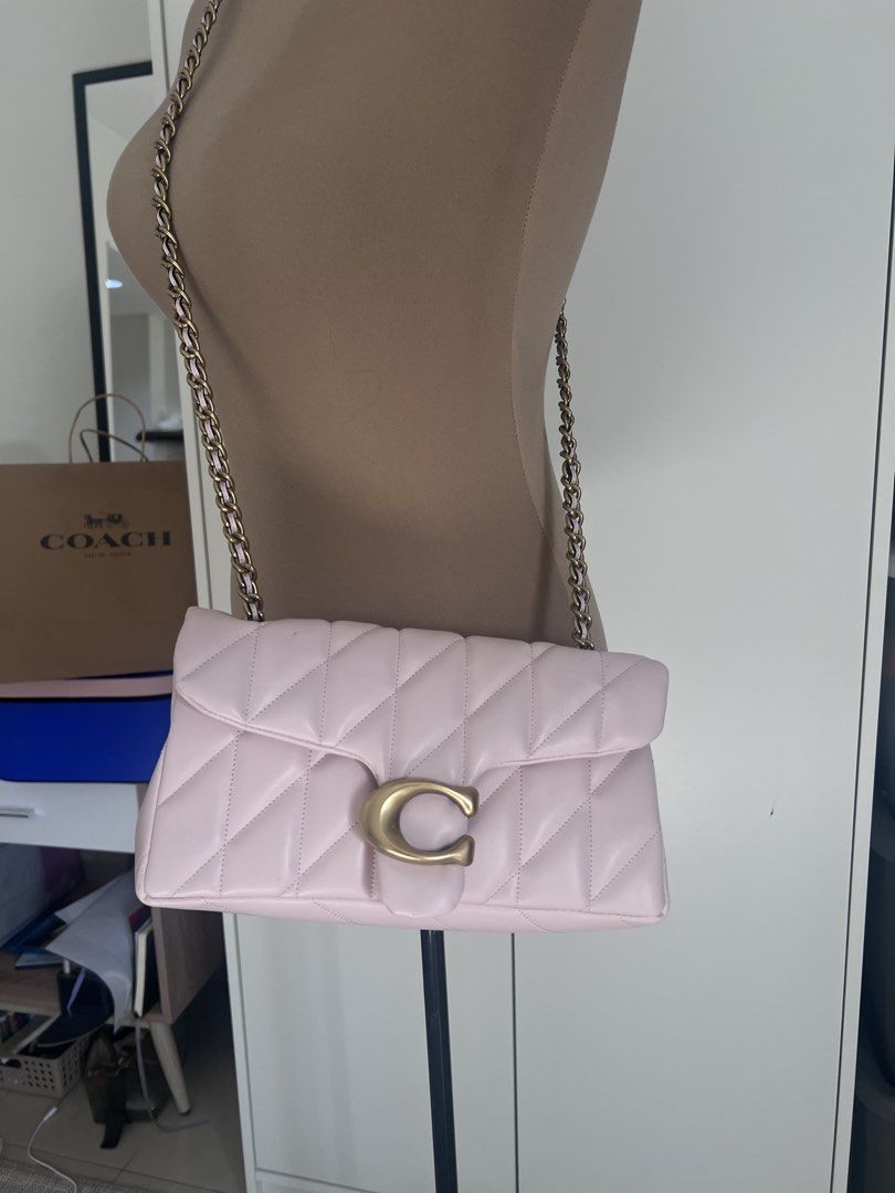 Coach Pillow Tabby Shoulder Bag (Category: Luxury Bags & Wallets) located in Quezon City. Submitted by shop.my_wardrobe (Listing ID 1437934230, Image 3). Description: NO ISSUE Hi there! This is dupe exact copy of Tabby Shoulder Quilted 26. Not Og, no issue, complete and includes dust bag, and Coach paper bag - Coach Pillow Tabby Shoulder Bag - Soft pink color - Quilted design - Gold-tone 'C' clasp - Chain strap.