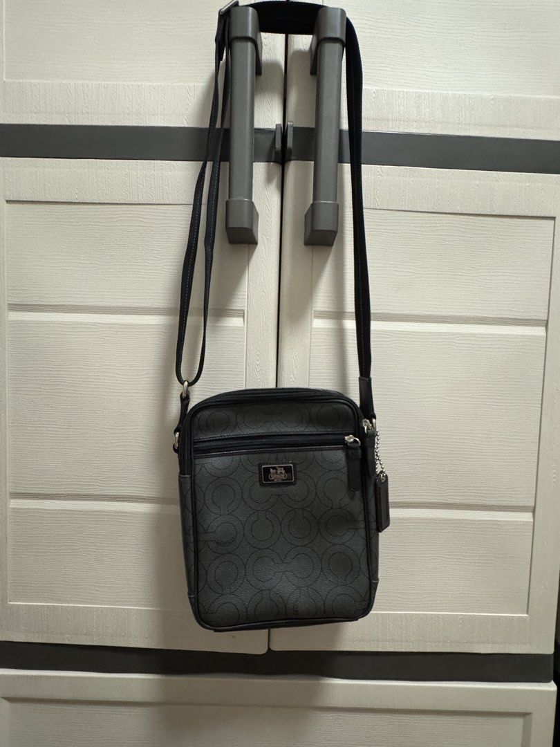 Coach Signature Crossbody Bag (Category: Luxury Bags & Wallets) located in Caloocan City. Submitted by r_h_e_a10 (Listing ID 1437871309, Image 1). Description: - Authentic Coach crossbody bag - Signature pattern design - Zippered main compartment - Exterior pocket for easy access - Detachable strap for versatile wear - Includes iconic Coach hangtag - Made of durable material - Silver-tone hardware - Perfect for everyday use.