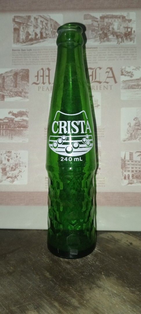 Crista Green Glass Bottle 240ml (Category: Water Bottles & Tumblers) located in Manila. Submitted by iamrich110502 (Listing ID 1437840788, Image 2). Description: - Vintage Crista bottle - 240ml capacity - Green glass with textured design - Features Crista logo - Empty bottle - Perfect for collectors or decoration.