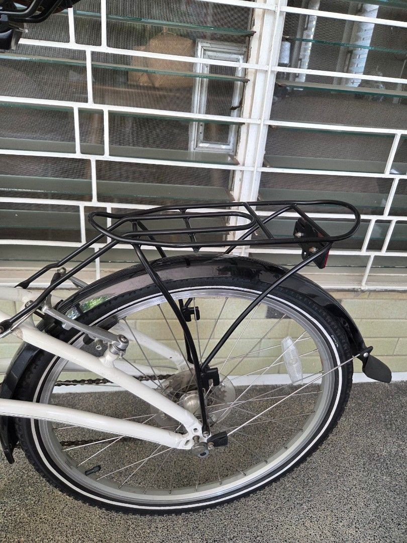 Dahon Briza D8-Speed Folding Bike (Category: Bicycles) located in Paranaque City. Submitted by lb19312 (Listing ID 1437777600, Image 2). Description: - Dahon Briza D8 - 24 inch Folding bike - 8 speed - Step -through design making it easier for riders to get on and off - Color: White with brown seat and handlebars - 8-speed gear system - Includes rear rack and fenders - Features dual kickstand and reflectors - Ideal for commuting or leisure rides 