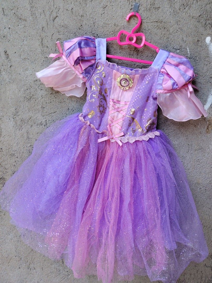 Disney Rapunzel Dress - Size 4 (Category: Babies & Kids Fashion) located in Makati City. Submitted by Prettykids (Listing ID 1437796794, Image 1). Description: - Disney Rapunzel Dress - Size: 4 (fits up to 104cm) - Colors: Purple and Pink - Glitter accents on skirt - Gold bodice detailing - Pink ribbon corset design - Includes Disney tag Original Disney Rapunzel Gown Size 4 GOOD AS NEW LOC: NUEVA ECIJA MOP:GCASH/BDO COURIER:J&T EXPRESS .