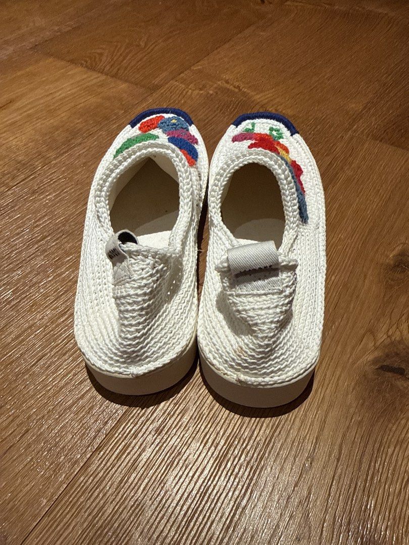 Embroidered White Slip-on Sneakers (Category: Sneakers) located in Makati City. Submitted by ral4738297 (Listing ID 1437886936, Image 3). Description: - White slip-on sneakers - Colorful embroidered designs (flowers, butterfly, abstract shapes) - Textured white fabric upper - White sole with blue trim - Pull tab at the back.