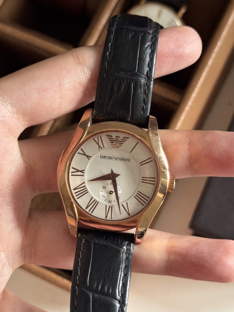 Emporio Armani AR-1670 Watch (Category: Luxury Watches) located in Taguig. Submitted by tjadeclutters (Listing ID 1437814130, Image 2). Description: - Emporio Armani watch - Rose Gold-tone case - Black leather strap - White dial with Roman numeral hour markers - Subdial feature - Solid stainless steel - Water-resistant up to 50 meters - Model: AR-1670 No battery Additional Php 300 if with battery RFS: decluttering Ships from BGC NO RETURNS / EXCH