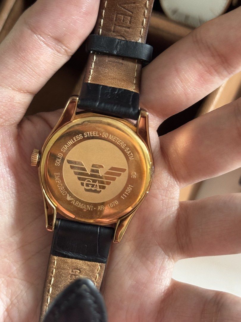 Emporio Armani AR-1670 Watch (Category: Luxury Watches) located in Taguig. Submitted by tjadeclutters (Listing ID 1437814130, Image 3). Description: - Emporio Armani watch - Rose Gold-tone case - Black leather strap - White dial with Roman numeral hour markers - Subdial feature - Solid stainless steel - Water-resistant up to 50 meters - Model: AR-1670 No battery Additional Php 300 if with battery RFS: decluttering Ships from BGC NO RETURNS / EXCH