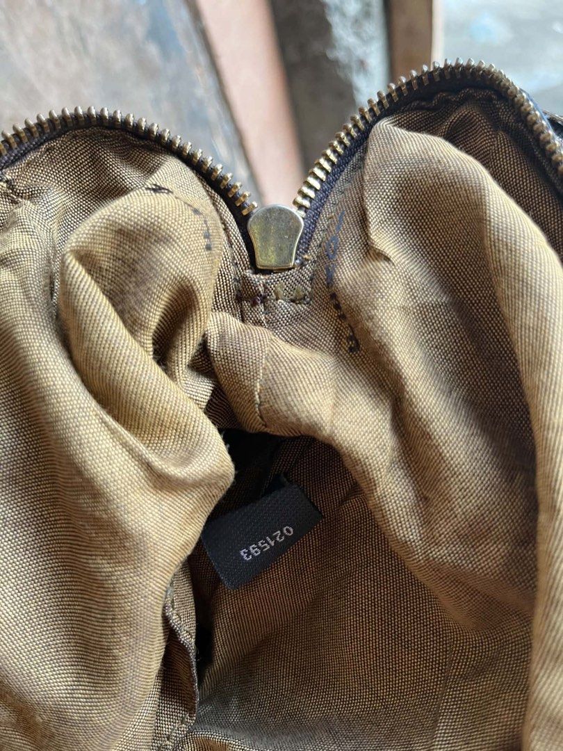 Fendi Brown FF Logo Handbag (Category: Luxury Bags & Wallets) located in Manila. Submitted by certhrified_legit21 (Listing ID 1437861733, Image 3). Description: - Authentic Fendi handbag - Iconic FF logo pattern - Color: Brown and beige - Double handles - Zipper closure - Metal hardware - Shoulder bag style - Interior tag number: 021593.