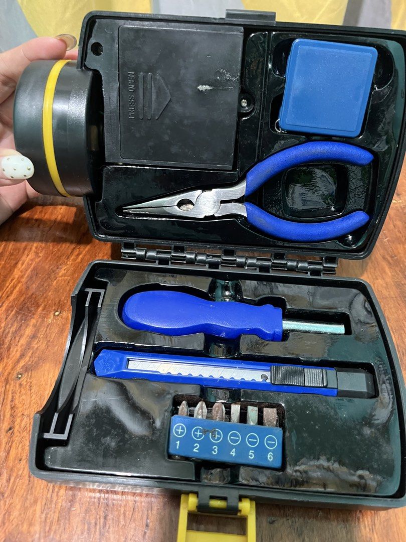 Flashlight with Tool Kit (Category: Home Improvement Tools & Accessories) located in Daet. Submitted by UkayanNiAnj (Listing ID 1437758496, Image 3). Description: - Big flashlight - Built-in tool kit: screwdriver, cutter, pliers, screwdriver heads, and retractable measuring tape - 4 AAA batteries needed - Features a handle - screwdriver heads are rusty and needs proper cleaning .