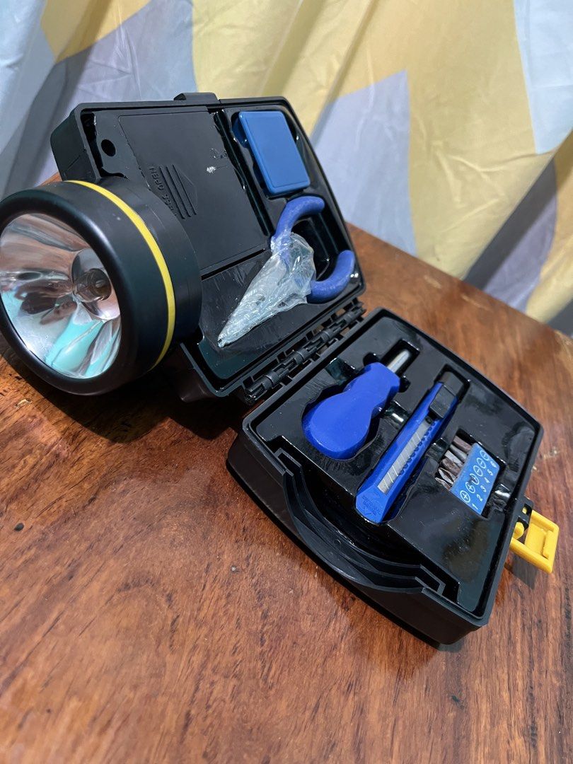 Flashlight with Tool Kit (Category: Home Improvement Tools & Accessories) located in Daet. Submitted by UkayanNiAnj (Listing ID 1437758496, Image 1). Description: - Big flashlight - Built-in tool kit: screwdriver, cutter, pliers, screwdriver heads, and retractable measuring tape - 4 AAA batteries needed - Features a handle - screwdriver heads are rusty and needs proper cleaning .